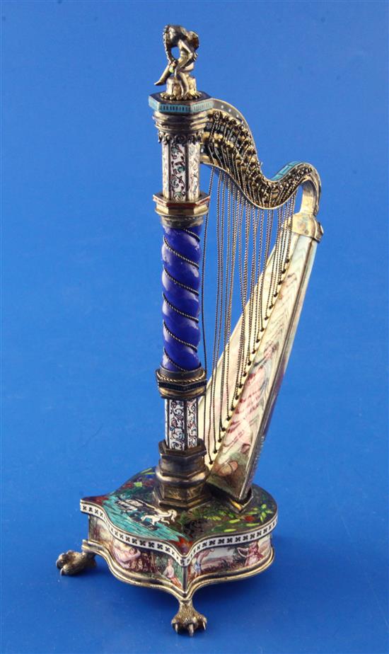 A good late 19th century Viennese silver and polychrome enamel timepiece modelled as a harp, by Hermann Bohm, 6.25in.